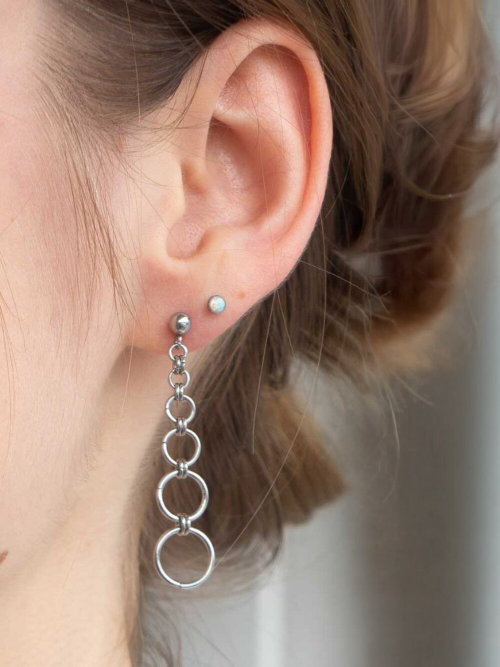 Long silver graduated hoop earrings